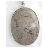 Carved cameo pendant from abalone with a small chi