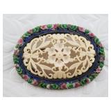 Silver and carved ivory brooch with enameled accen