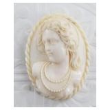 Antique ivory brooch depicting a Victorian woman,