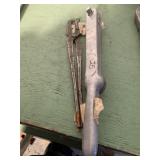 Torque wrench and a pair of tongs