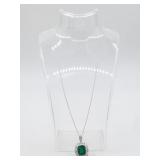 Emerald, diamond and platinum pendant on platinum
