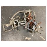 Two pairs of metal snow cleats