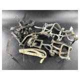 Pair of ice cleats with leather straps