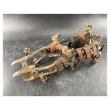 Pair of ice cleats with leather straps