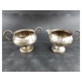 Sterling silver creamer and pitcher set.  By Fishe