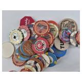 Assorted poker chips, gambling chips, a round tuit
