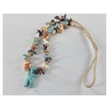 Necklace with many carved stone bears, the large c