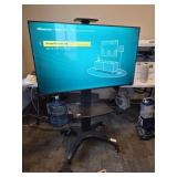 Hisense Roku TV on rolling stand. In perfect worki