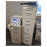 Two metal filing cabinets. One is 4 drawer, one is
