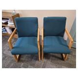 Pair of upholstered chairs with hardwood frames.