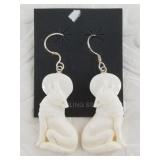Gorgeous pair of bone carved earrings depicting wo