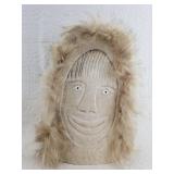 Humorous whalebone carving from whalebone flipper,