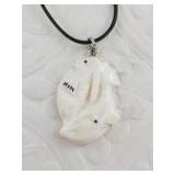 Carved ivory pendant with bale on a short cord