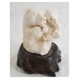 Michael Scott in the round carving of a mother bea