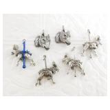 Several silver-tone charms, including several caro