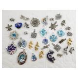 Box full of silver-tone charms, mostly Southwest s