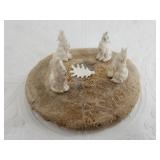 Scenery of a pack of wolves lamenting their loss a