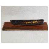 Nicely restored ancient ivory artifact with a wood