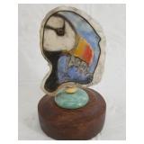 Michael Scott scrimshaw of puffin in color, on a p