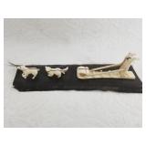 Ivory carving of various Alaskan animals and mushe