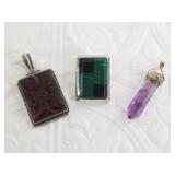 Three sterling silver pendants: 1 has malachite, 1