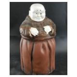 Antique cookie jar of a rather portly Franciscan M