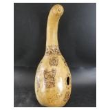 Beautiful wood burned board showing various people