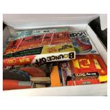 Box full of board games: ping pong, Sorry, etc.