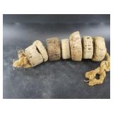 Strand of antique cork fishing net floats