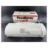 Lot with a food saver and extra bags