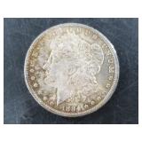 Morgan silver dollar:  1884 O  AU 55 or better