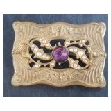 A beautiful Art Nouveau brooch with a faceted cent
