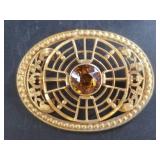 A beautiful Art Nouveau brooch with a faceted cent