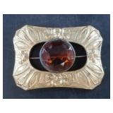 A beautiful Art Nouveau brooch with a faceted cent