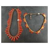 Pair of red enamel and copper necklaces