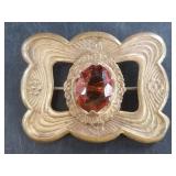 A beautiful Art Nouveau brooch with a faceted cent