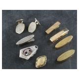 Several tie tacs and cufflinks