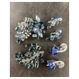 Several pieces of blue rhinestone jewelry