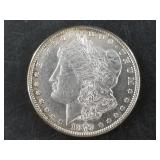 Morgan silver dollar:  1879 S  7 tail feathers fir