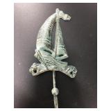 Cast iron sail boat wall hook with a lovely faux p