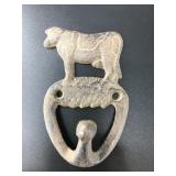 Single hook cast iron cow themed wall hook. It is