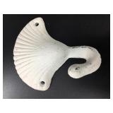Cast iron white colored shell shaped hook. 4.5in l
