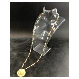 Bone, freshwater pearl, and tiger eye agate neckla