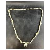 Bone beaded necklace of elephants, likely from Ind