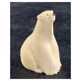 J. Uglowook ivory polar bear from the tip of a fem