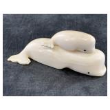 2 Beluga whale carvings from a previous larger pie