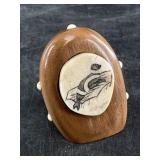 Peter Mayac scrimshawed ivory platchet of a seal,