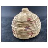 Small lidded N.W. grass basket with dyed grass inc