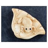 Mammoth ivory Japanese netsuke of a frog on a leas