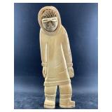 Whalebone carving of a Native Alaskan man wearing